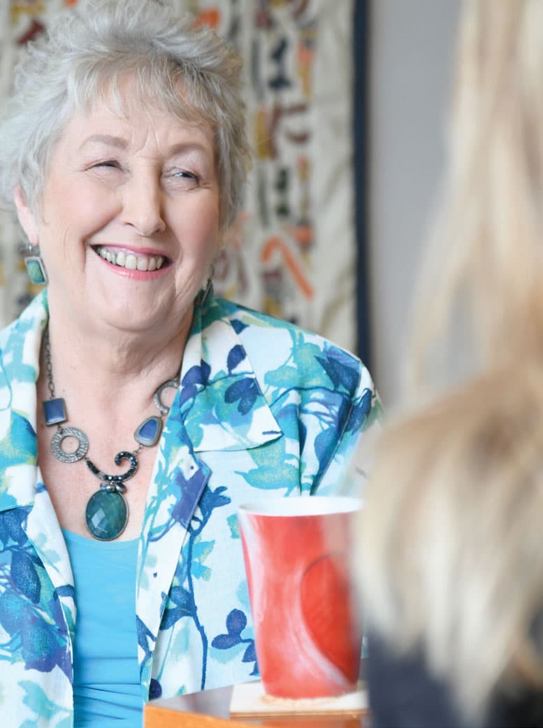 Client Jenny shares a laugh with her friend