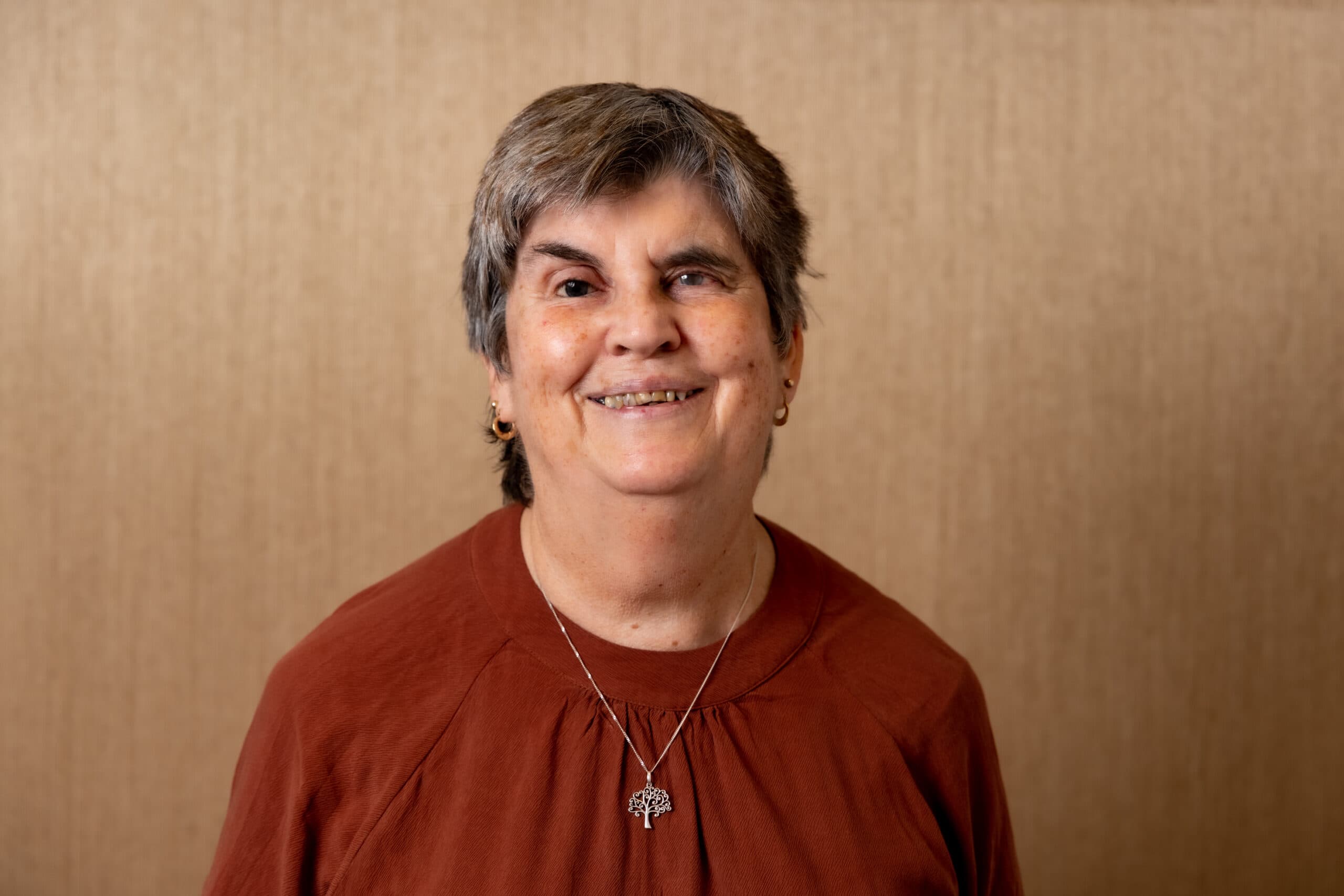 RNZFB Board member Judy Small smiles at the camera