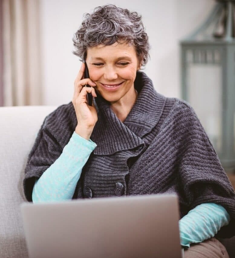 A middle-aged woman talks to someone on the phone