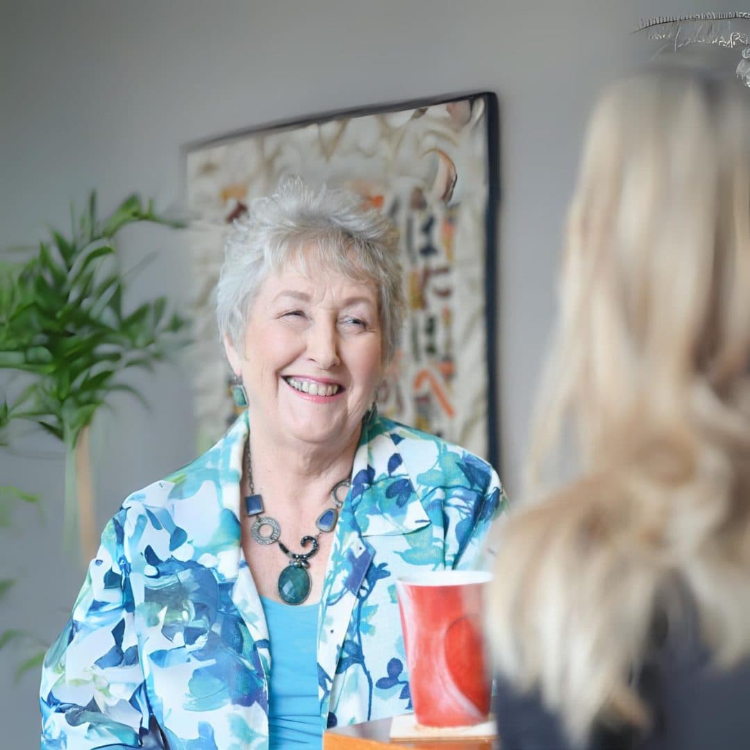 Client Jenny shares a laugh with her friend