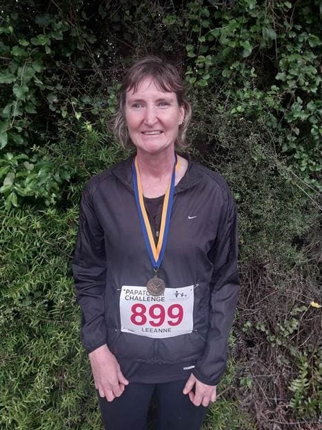 Leeanne wearing a sports medal.