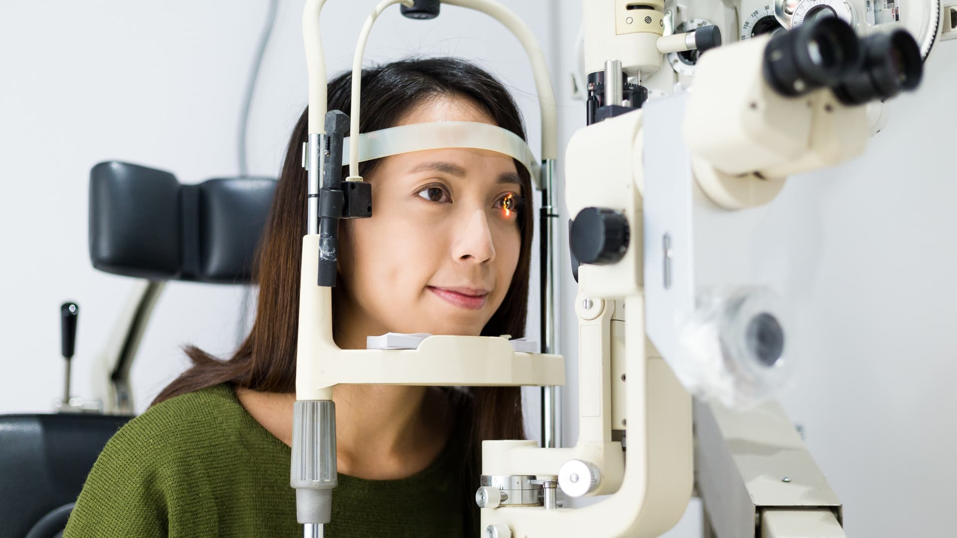 A young woman is having an eye conditions test