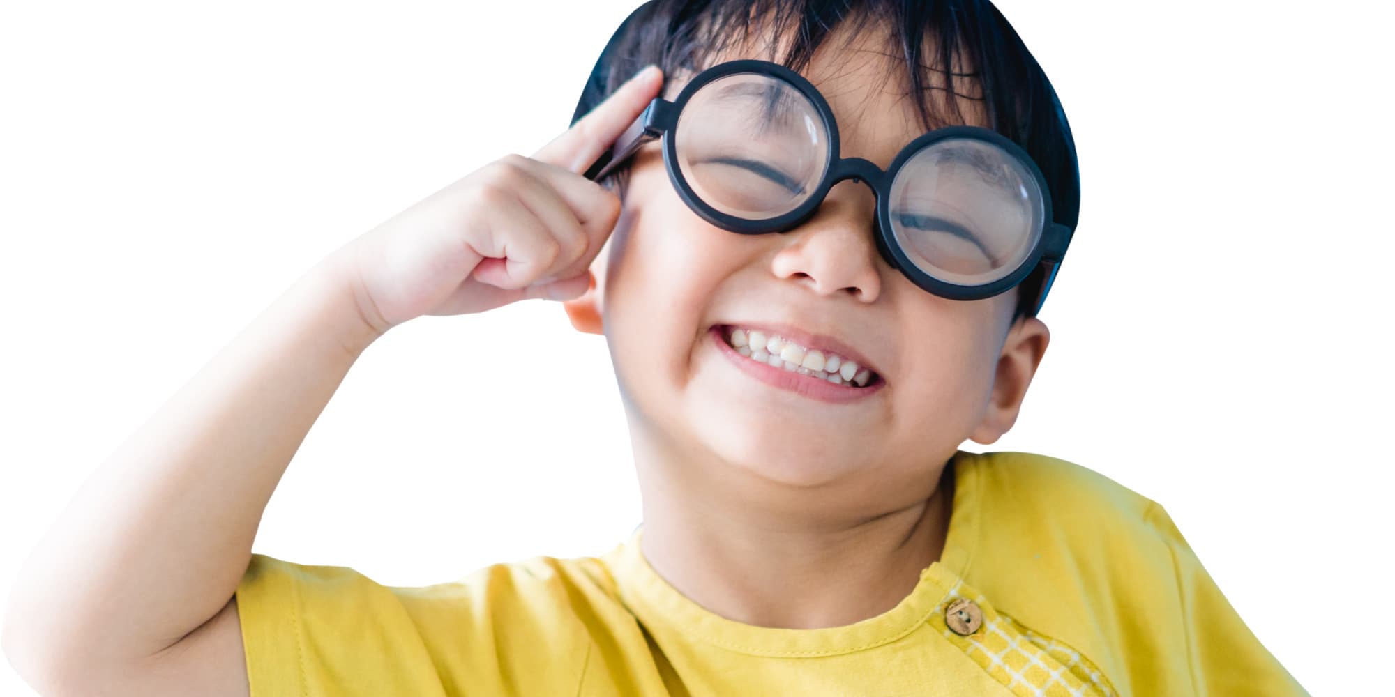 A child looking happy while wearing large rounded glasses.